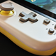 A Hori Split Pad Compact sits equipped on a Nintendo Switch.